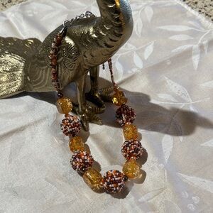 Elegant Beaded Necklace with Amber and Brown Tones